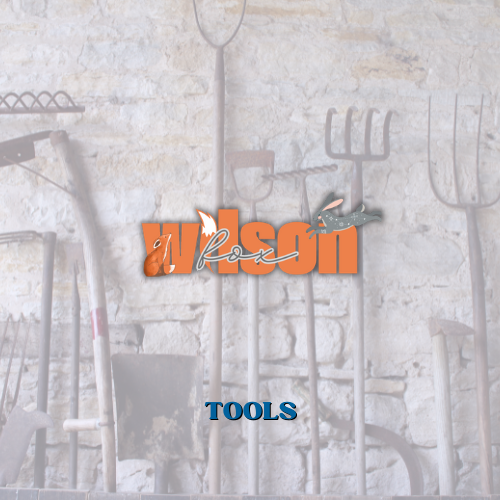 A wall with a bunch of tools and the word tools advertising Wilson Fox Antiques tools for sale
