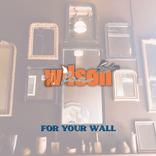 A wall with a lot of mirrors and pictures. Advertising antiques for your wall for sale at Wilson Fox Antiques