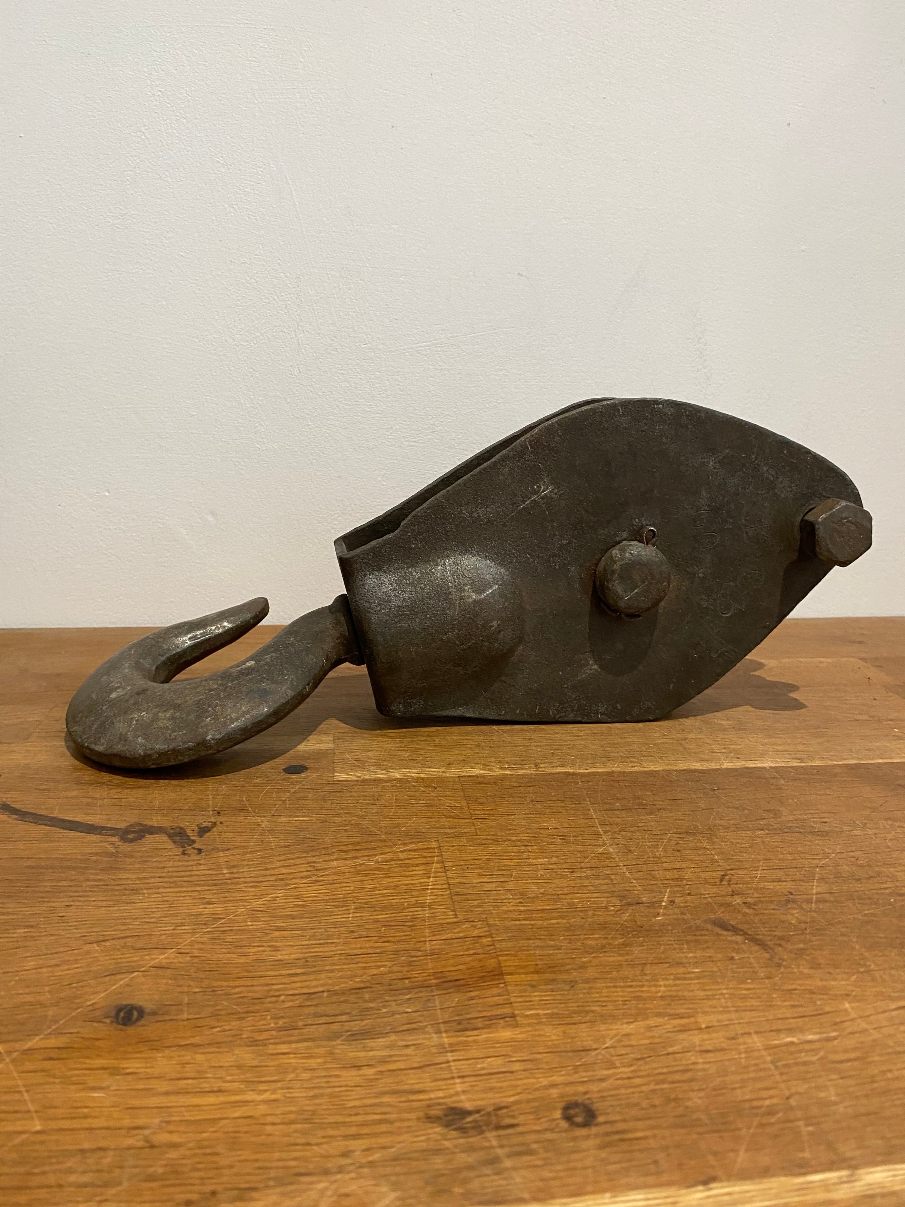 Large heavy industrial block and tackle, pulley wheel