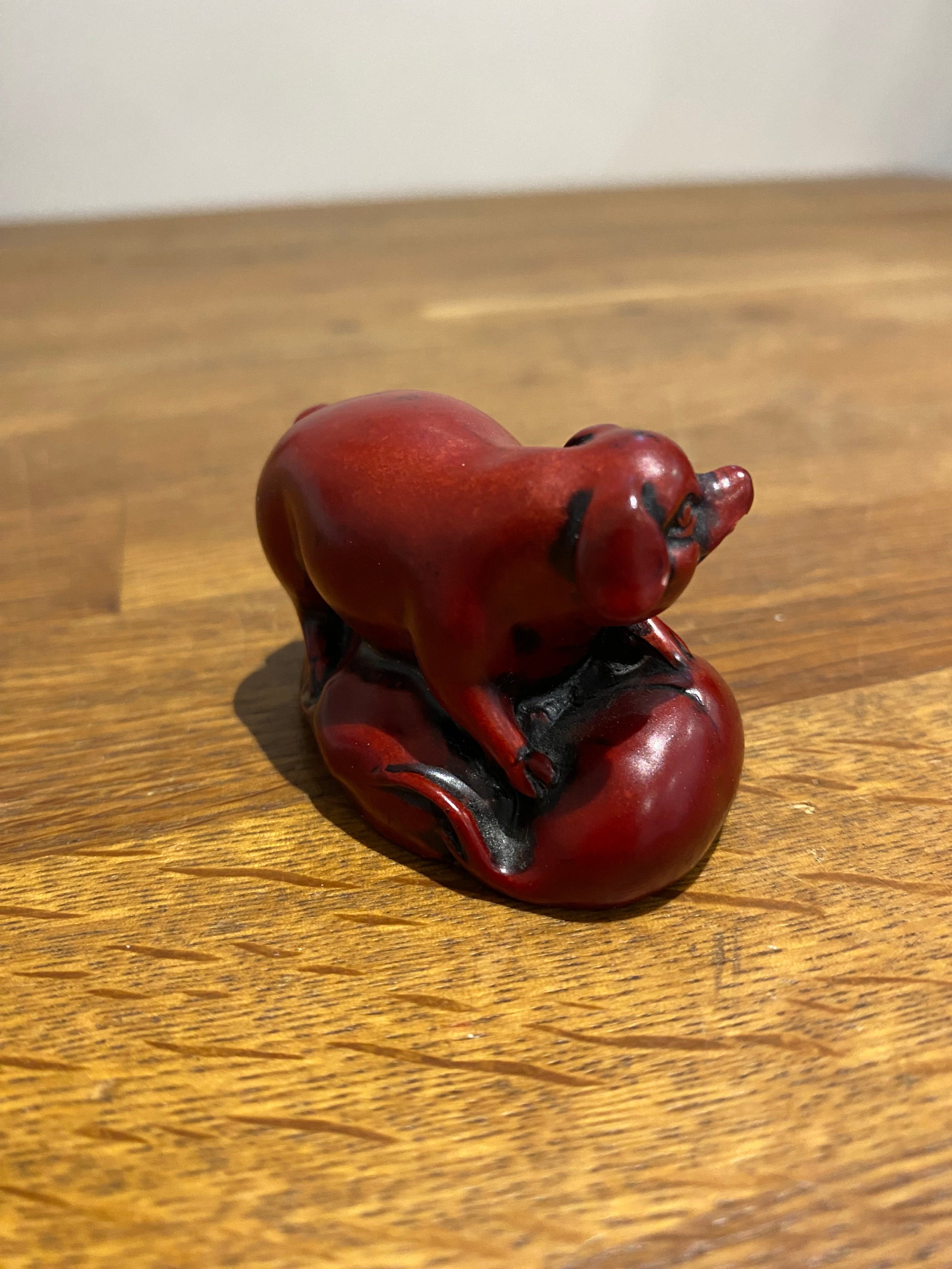 Miniature Chinese year of the pig resin figure.
