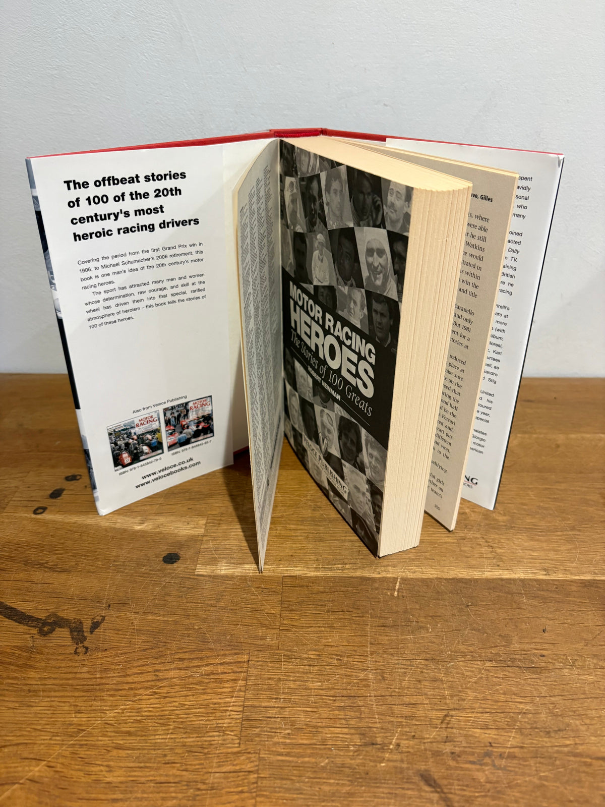 Motor racing heroes, the stories of 100 greats , Robert Newman , hardback