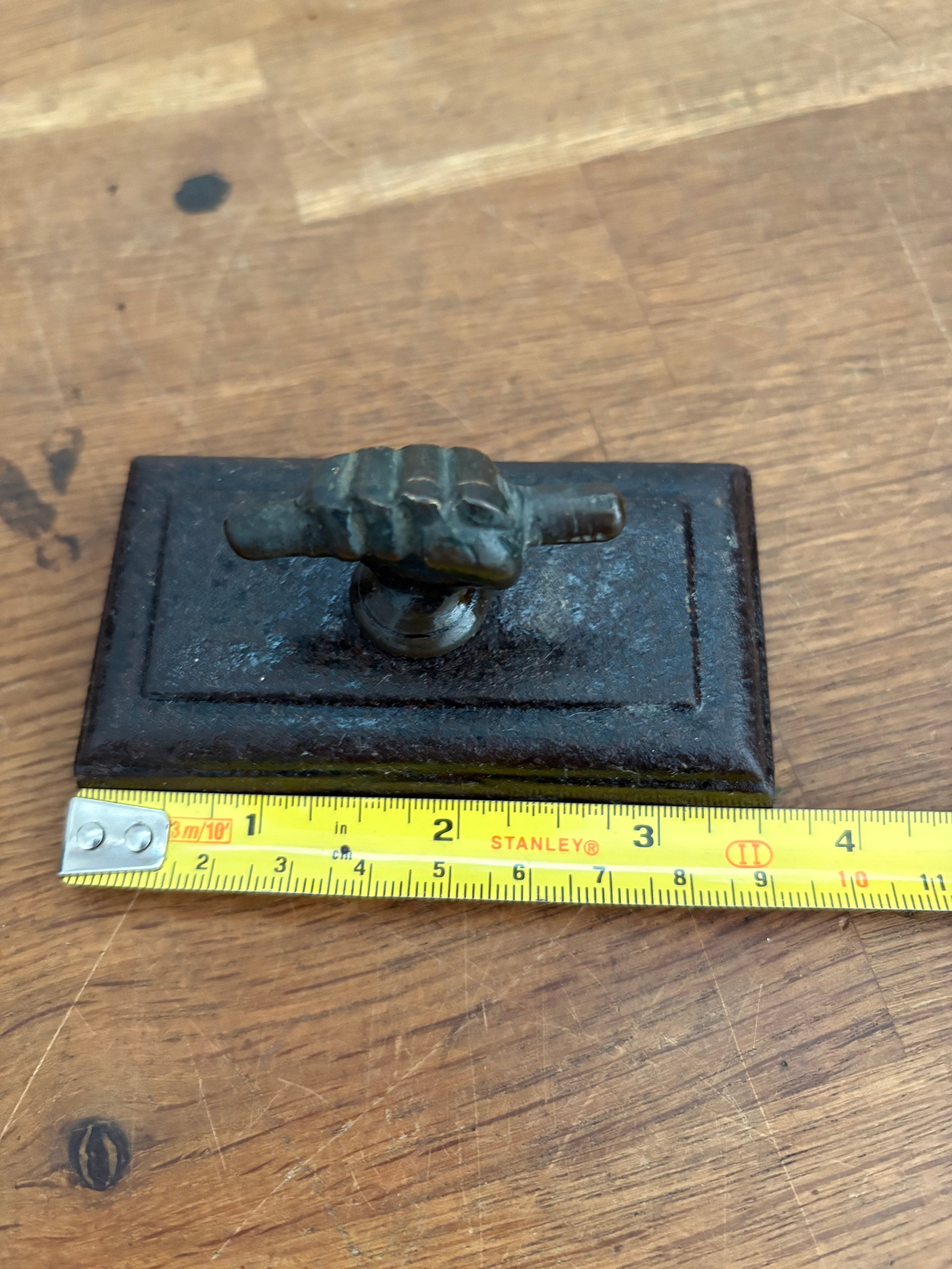 Antique Cast Iron Paperweight, Fist And Scroll/ Hand And Scroll . Brass Hand