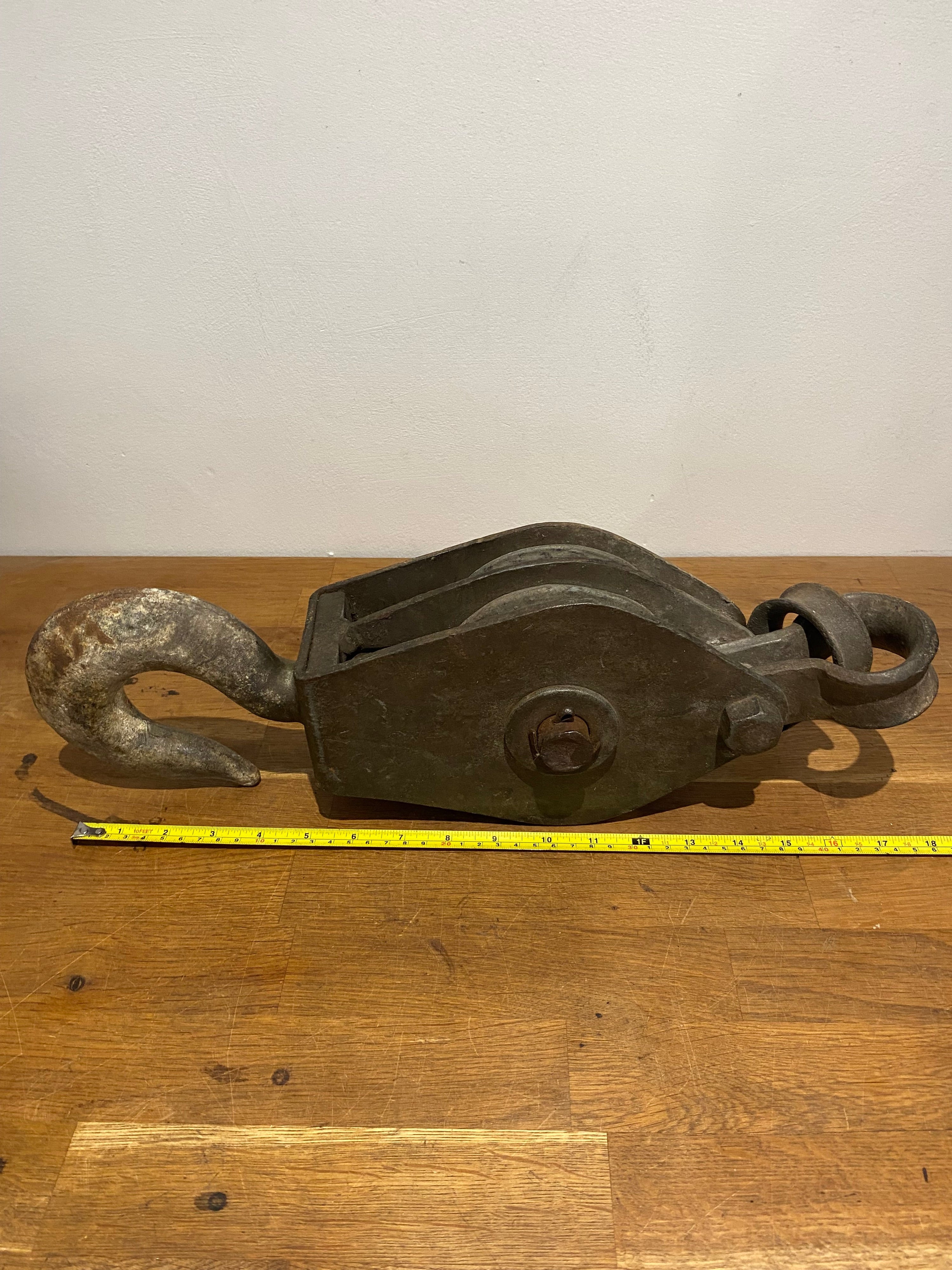 Very large industrial cast block and tackle, double pulley.