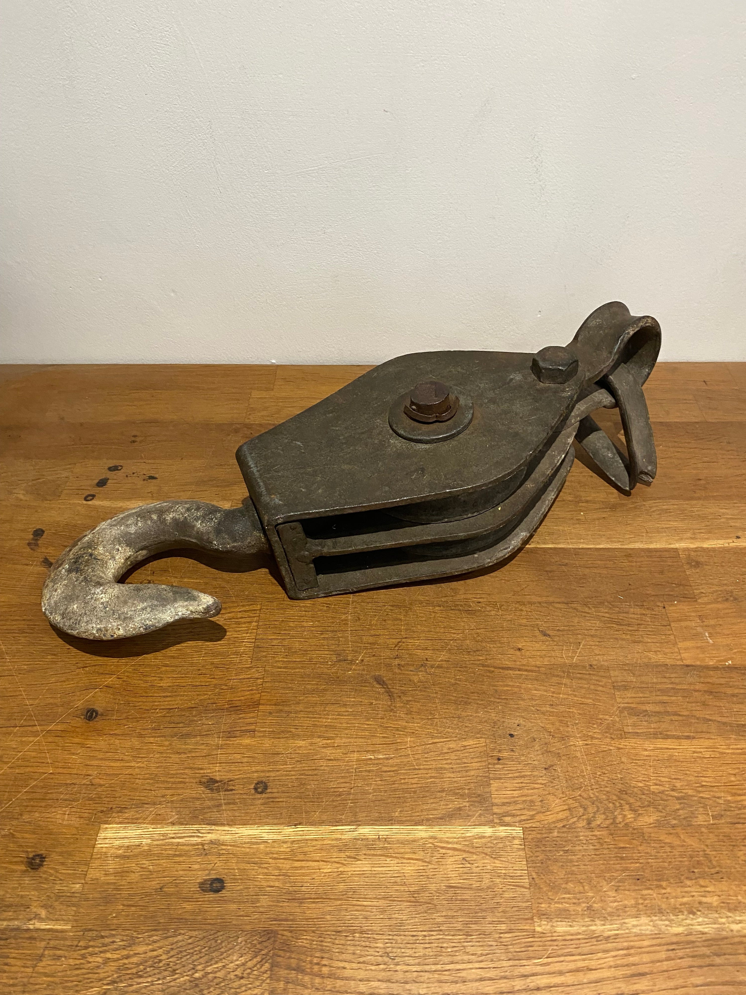 Very large industrial cast block and tackle, double pulley.
