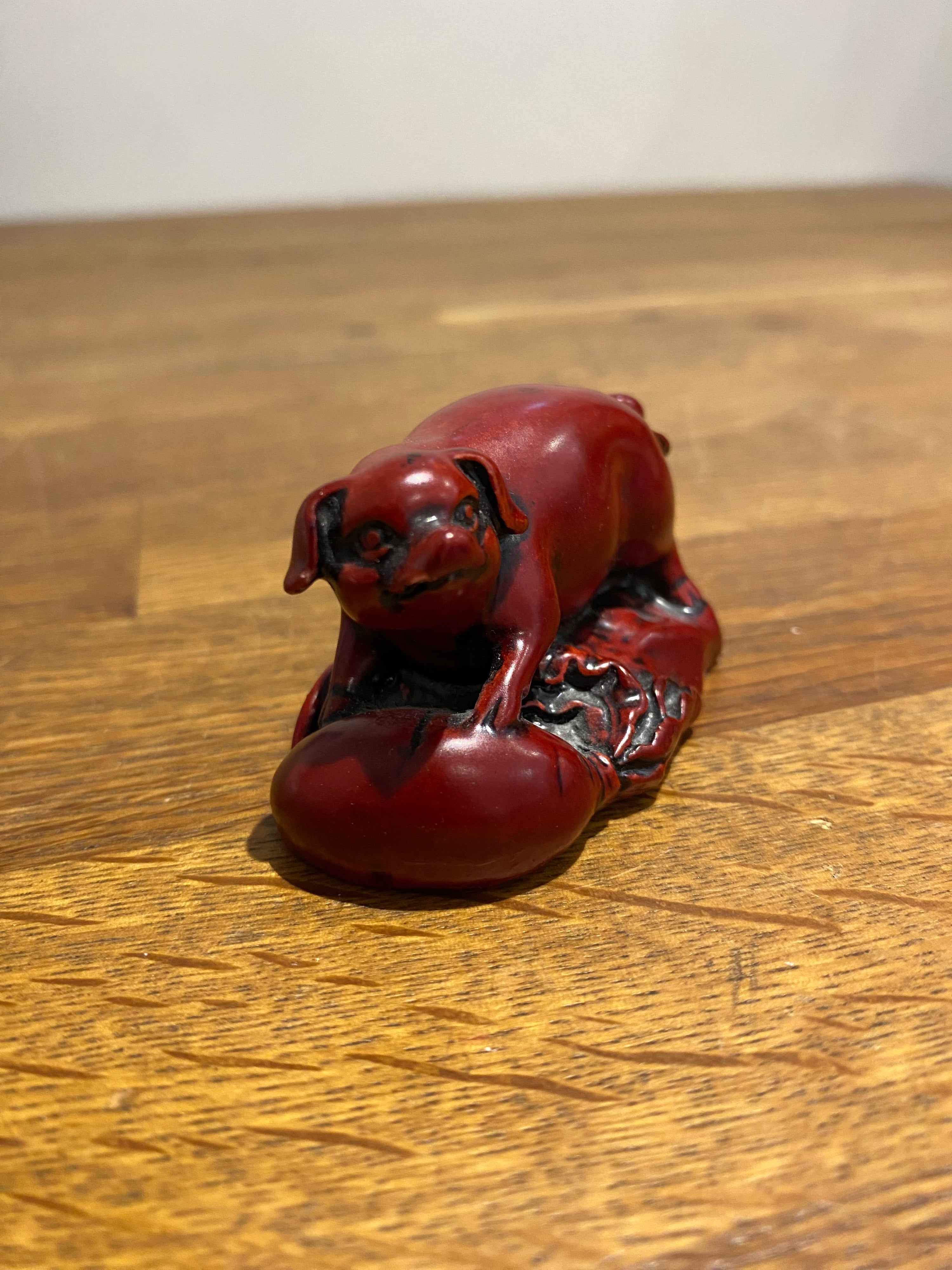 Miniature Chinese year of the pig resin figure.