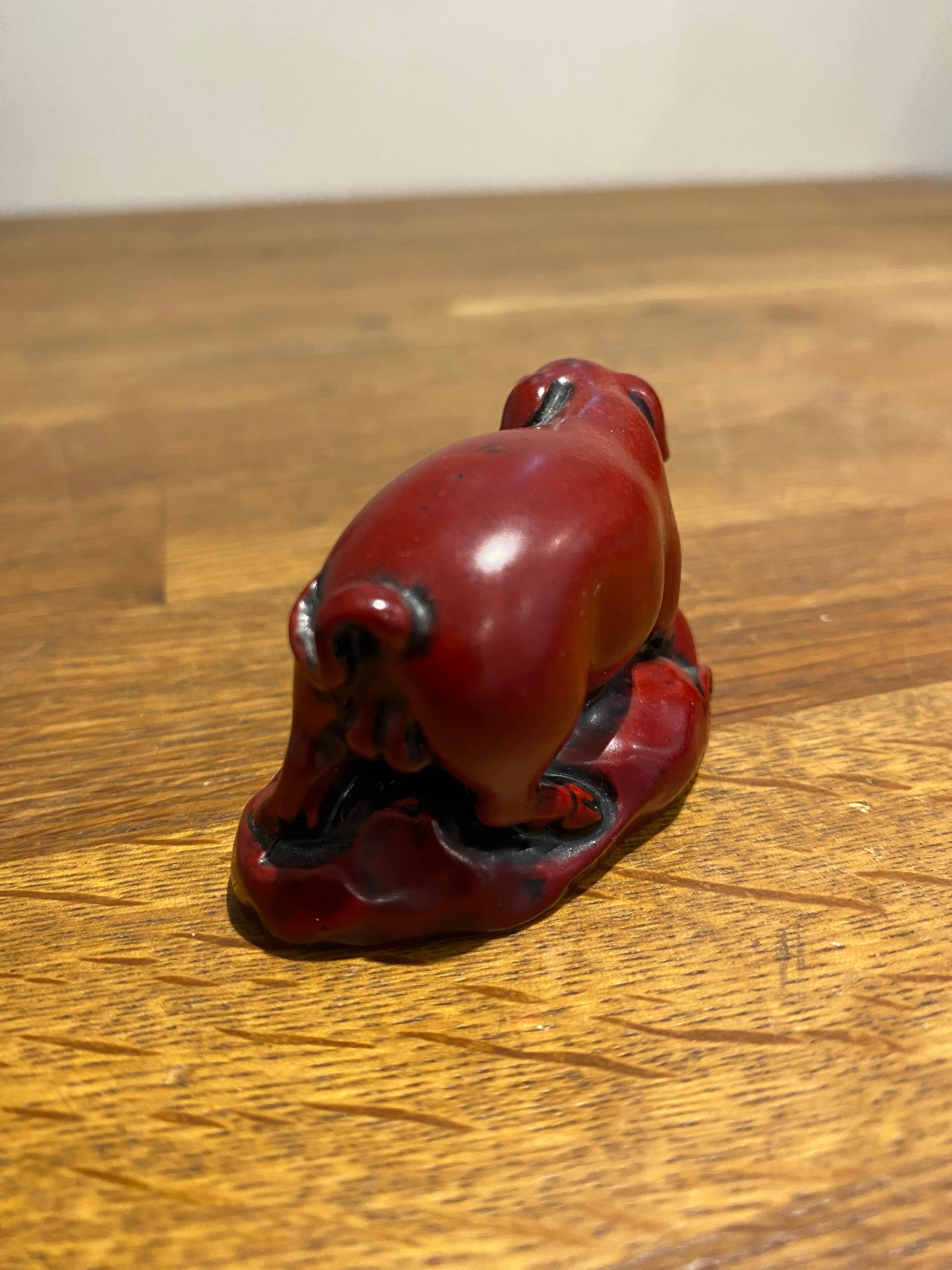 Miniature Chinese year of the pig resin figure.