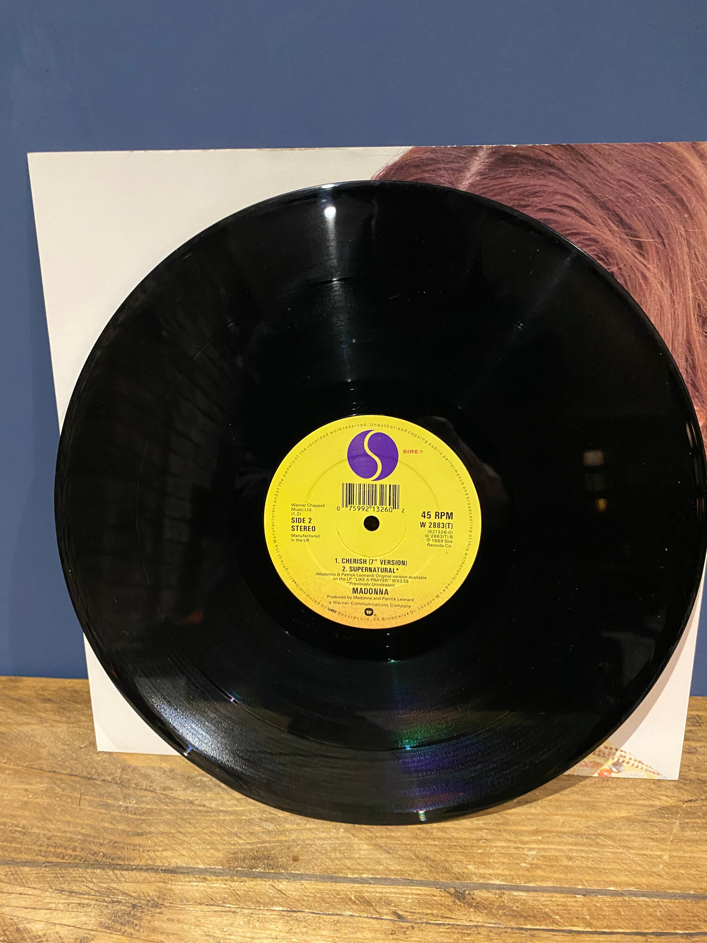 Picture of vinyl record titled Cherish a single by Madonna.