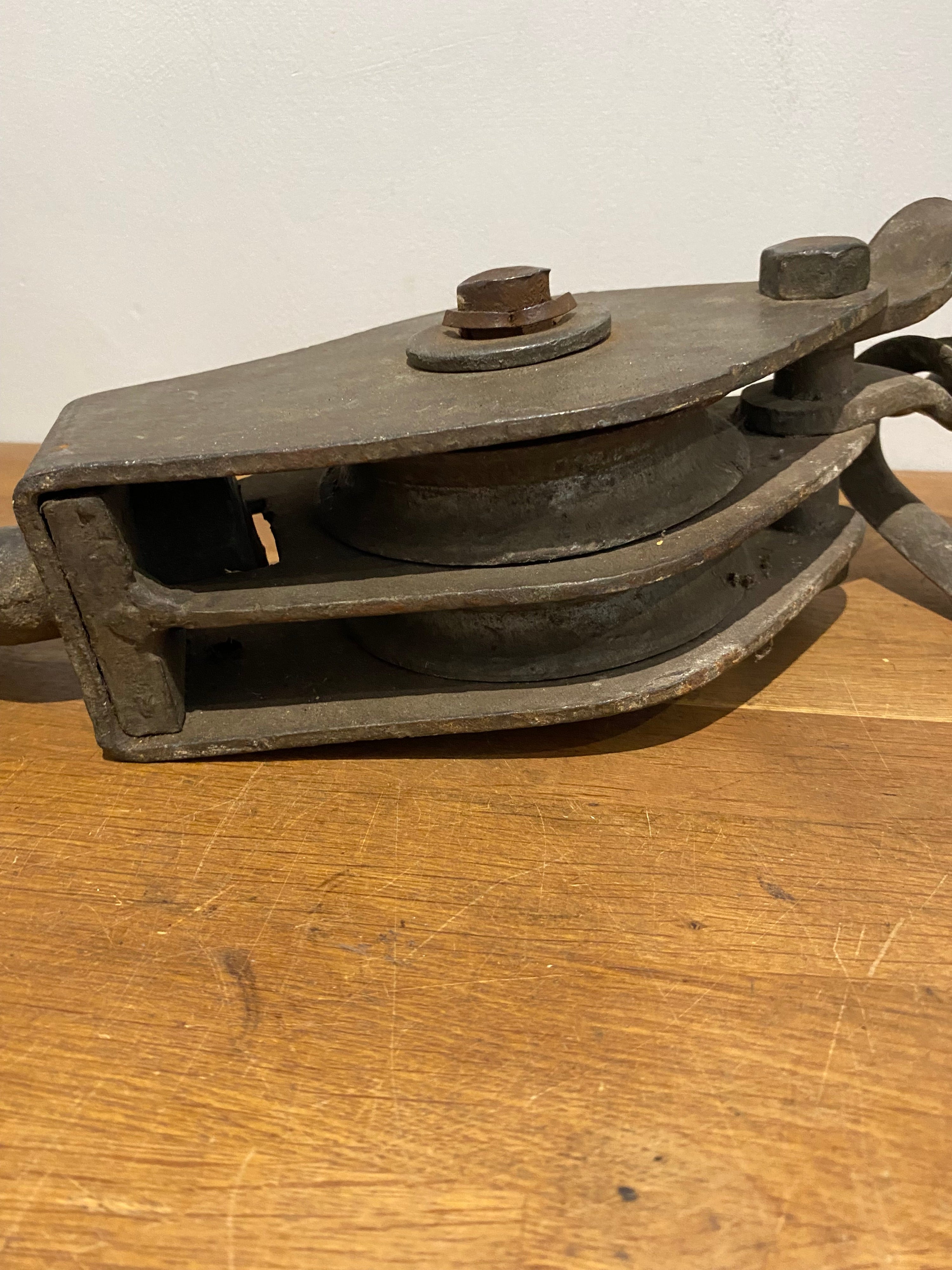Very large industrial cast block and tackle, double pulley.