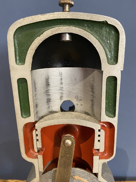 Vintage Cutaway Piston Engine Mounted On A Wooden Base